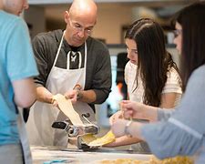 Hands kneading fresh pasta dough